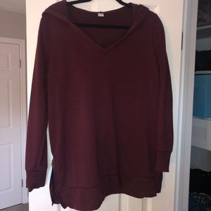 Maroon sweater with zippers and hood